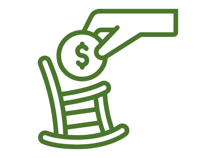 Hand placing money on a rocking chair
